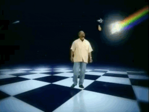 Animated image of LeVar Burton being swaddled by a rainbow, captured from the kids' television show "Reading Rainbow"