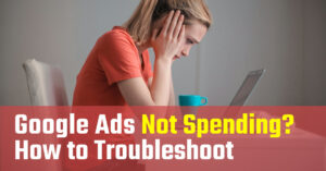 Woman looking at a laptop in frustration, wondering "Why are my Google Ads not spending?"