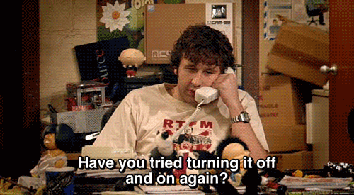 Scene from the TV show IT crowd with Roy asking "Have you tried turning it off and on again?"